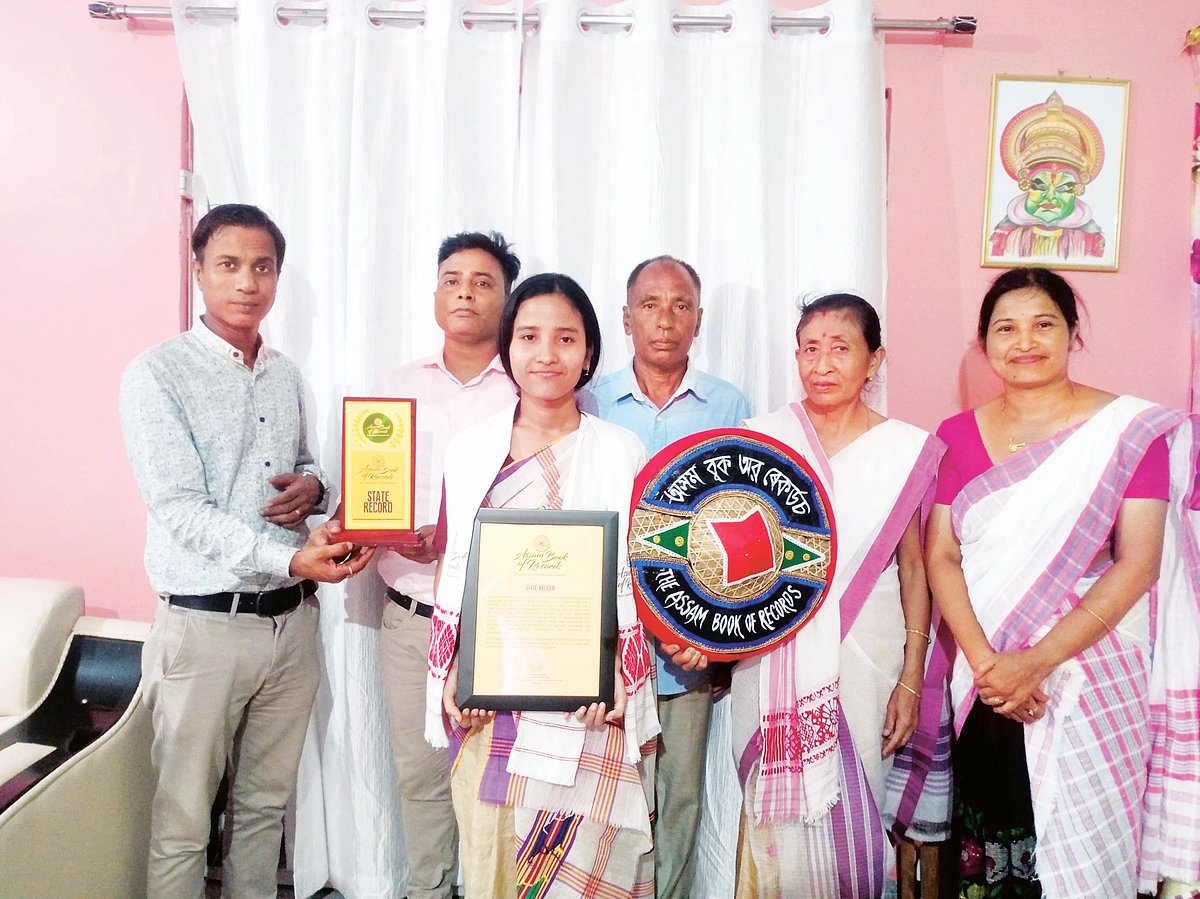Demow girl Moyur Krishna Gogoi Sets Record with 14x4 Foot Assamese